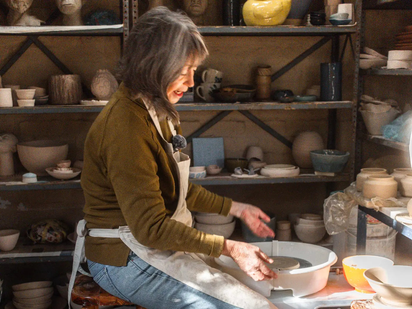 One of our partner potters throwing a bowl on a HobbiesForAll pottery wheel